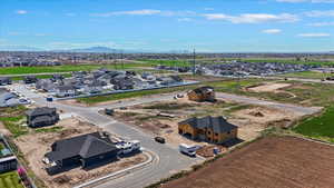 Aerial perspective of suburban area featuring a mountain backdrop