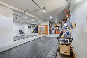 Garage featuring a garage door opener