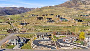 View of property location featuring a mountainous background and nearby suburban area
