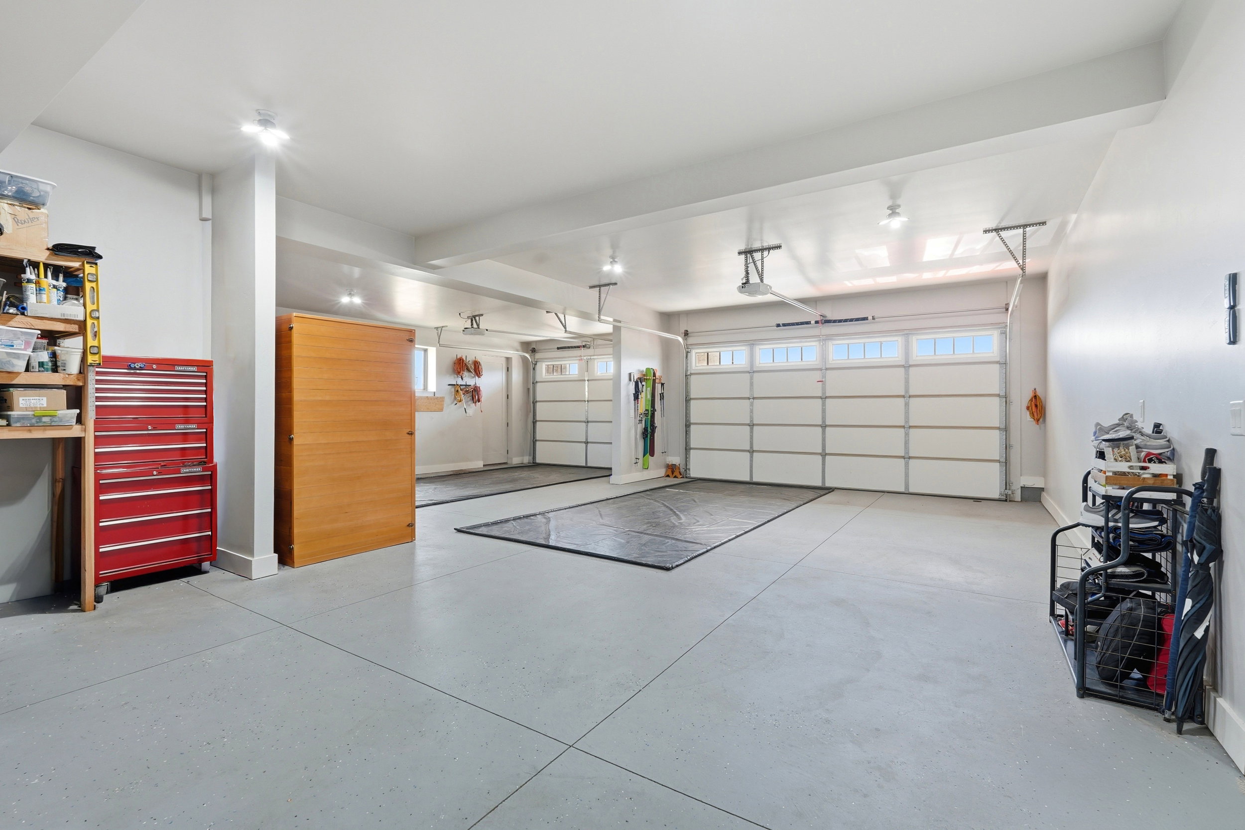 Garage featuring baseboards