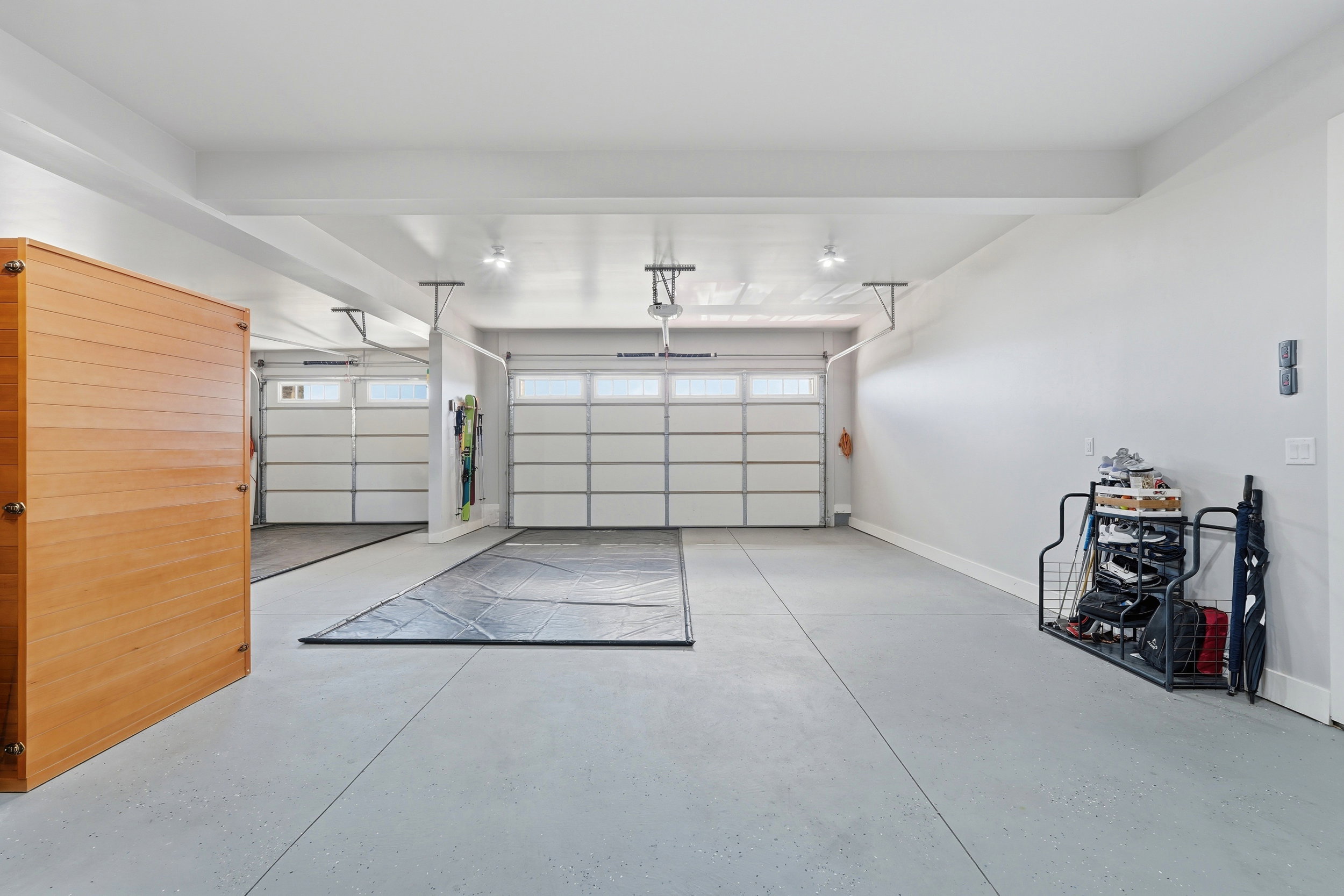 Garage featuring baseboards and a sauna