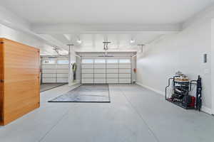 Garage featuring baseboards and a sauna