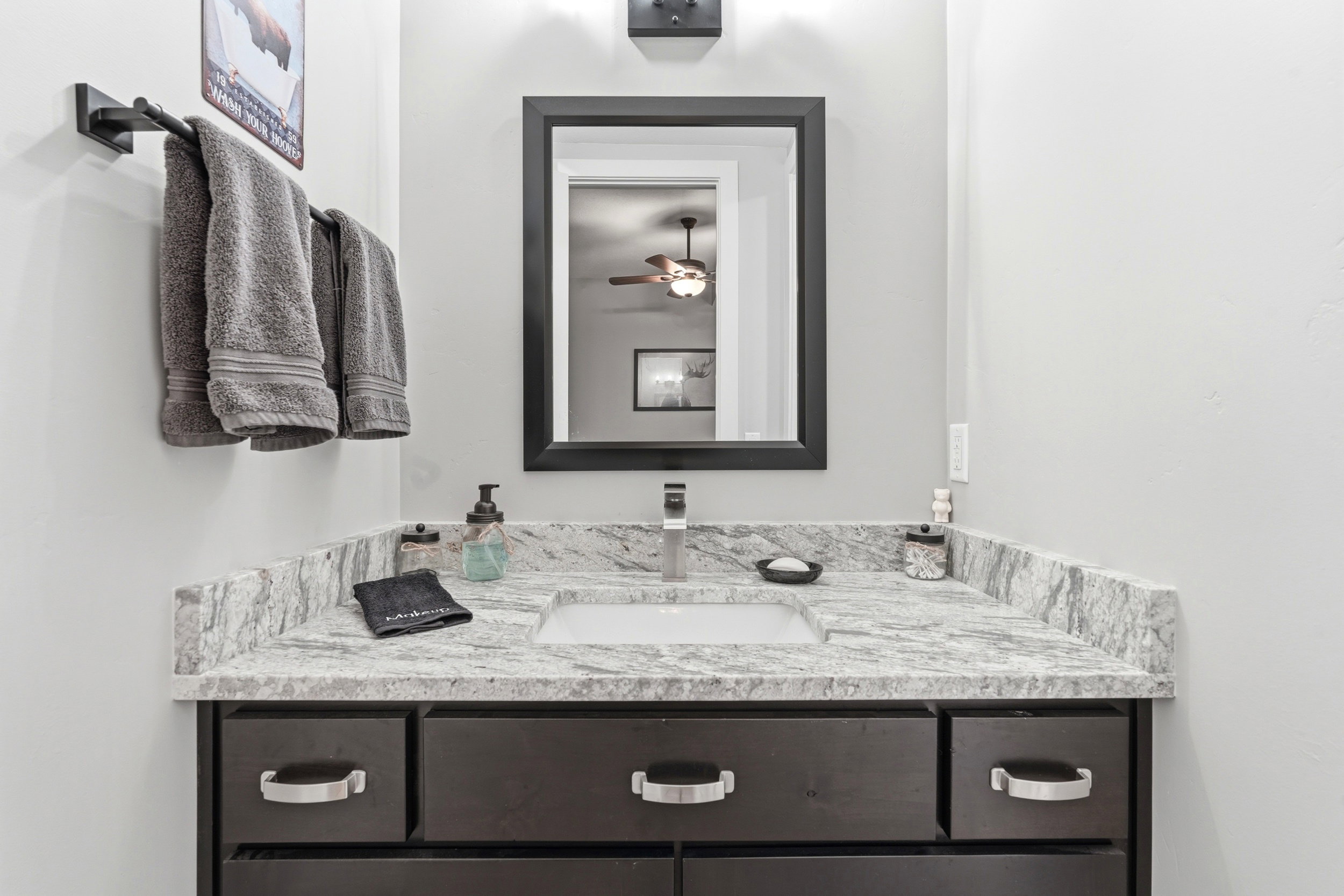 Bathroom with vanity and ceiling fan