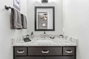Bathroom with vanity and ceiling fan