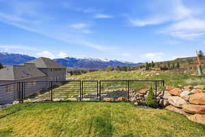 View of yard featuring a gate and a mountain view