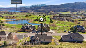 Aerial perspective of suburban area with a water and mountain view