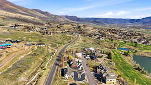Aerial perspective of suburban area featuring a water and mountain view