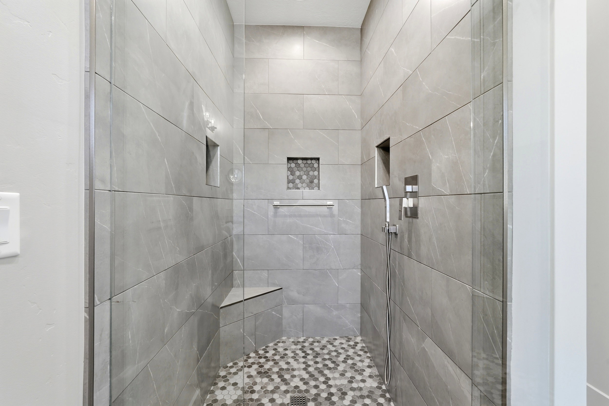 Full bath with a tile shower