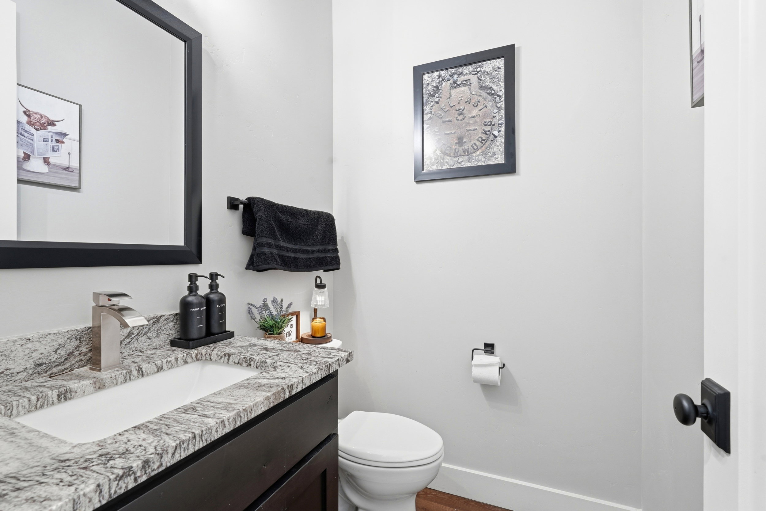 Bathroom with vanity and dark wood-type flooring