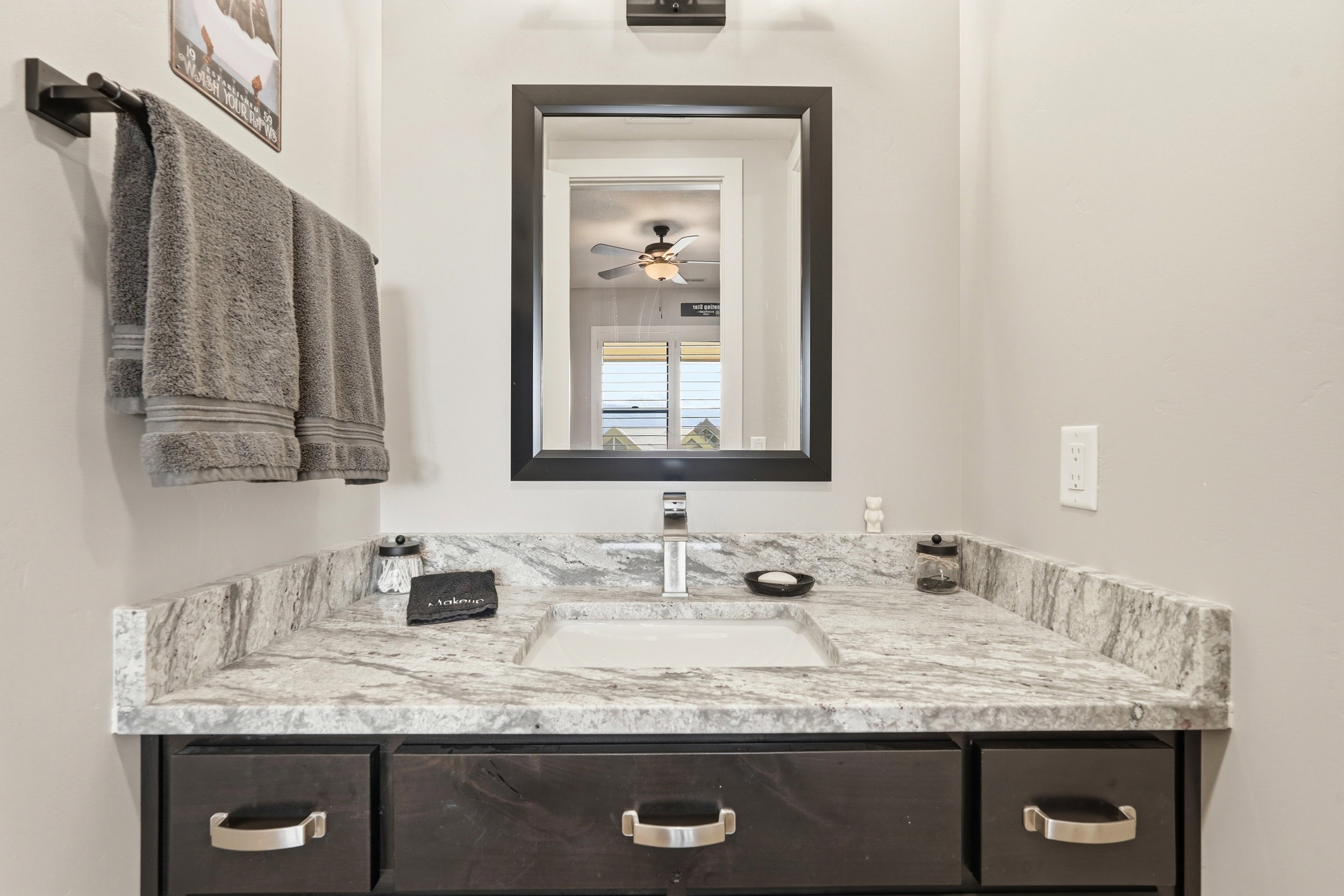 Bathroom featuring vanity and ceiling fan