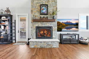 Living room featuring a fireplace and light wood finished floors