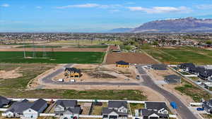 Aerial perspective of suburban area with a mountainous background