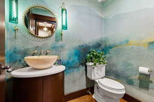 Bathroom featuring vanity and wood finished floors