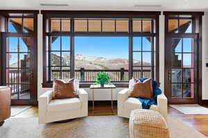 Sunroom / solarium with a mountain view