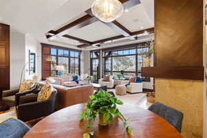 Dining space featuring coffered ceiling and recessed lighting