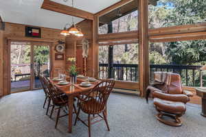 Dining area with french doors stpping out to large deck