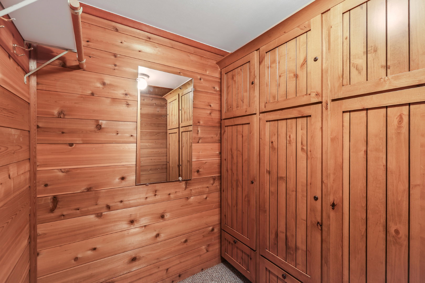 Master closet with built in cabinets and drawers