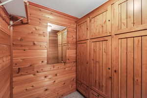 Master closet with built in cabinets and drawers