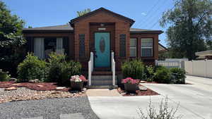 View of front facade with roof with shingles
