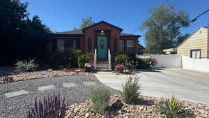 View of front of house featuring a gate