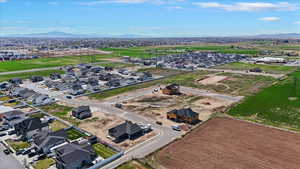 Aerial view of residential area featuring a mountainous background