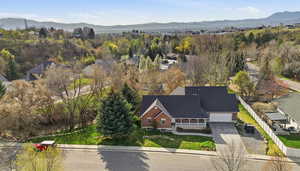 Aerial view of residential area featuring a mountain backdrop