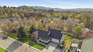 Aerial perspective of suburban area with a mountain backdrop