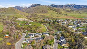 Aerial perspective of suburban area with a mountain backdrop