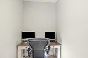 Office area with light wood-style floors