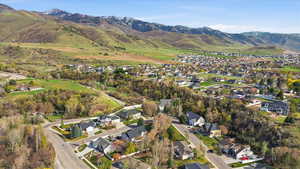Aerial perspective of suburban area with a mountainous background