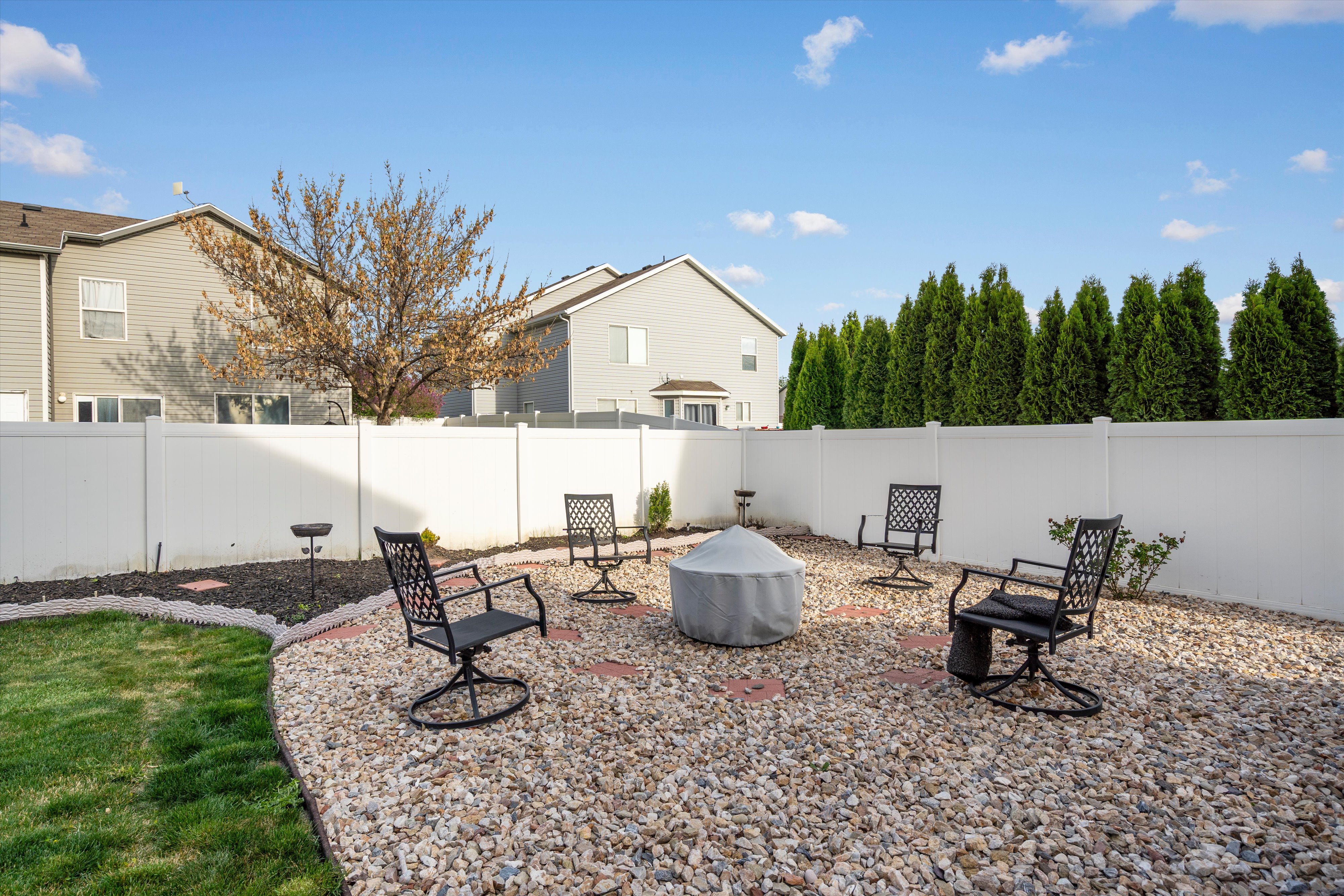 Fenced backyard with a patio
