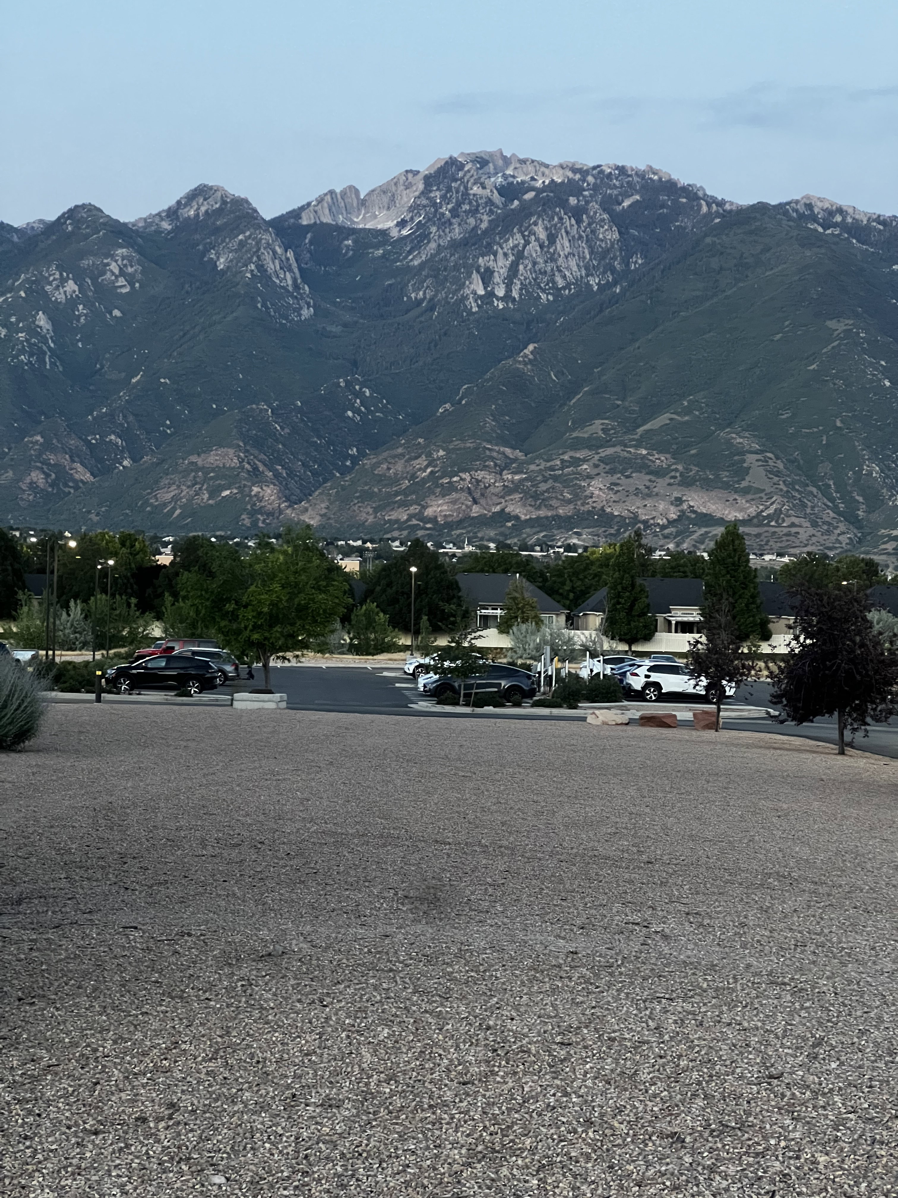 Mountain range backdrop with natural rock formations and dense foliage
