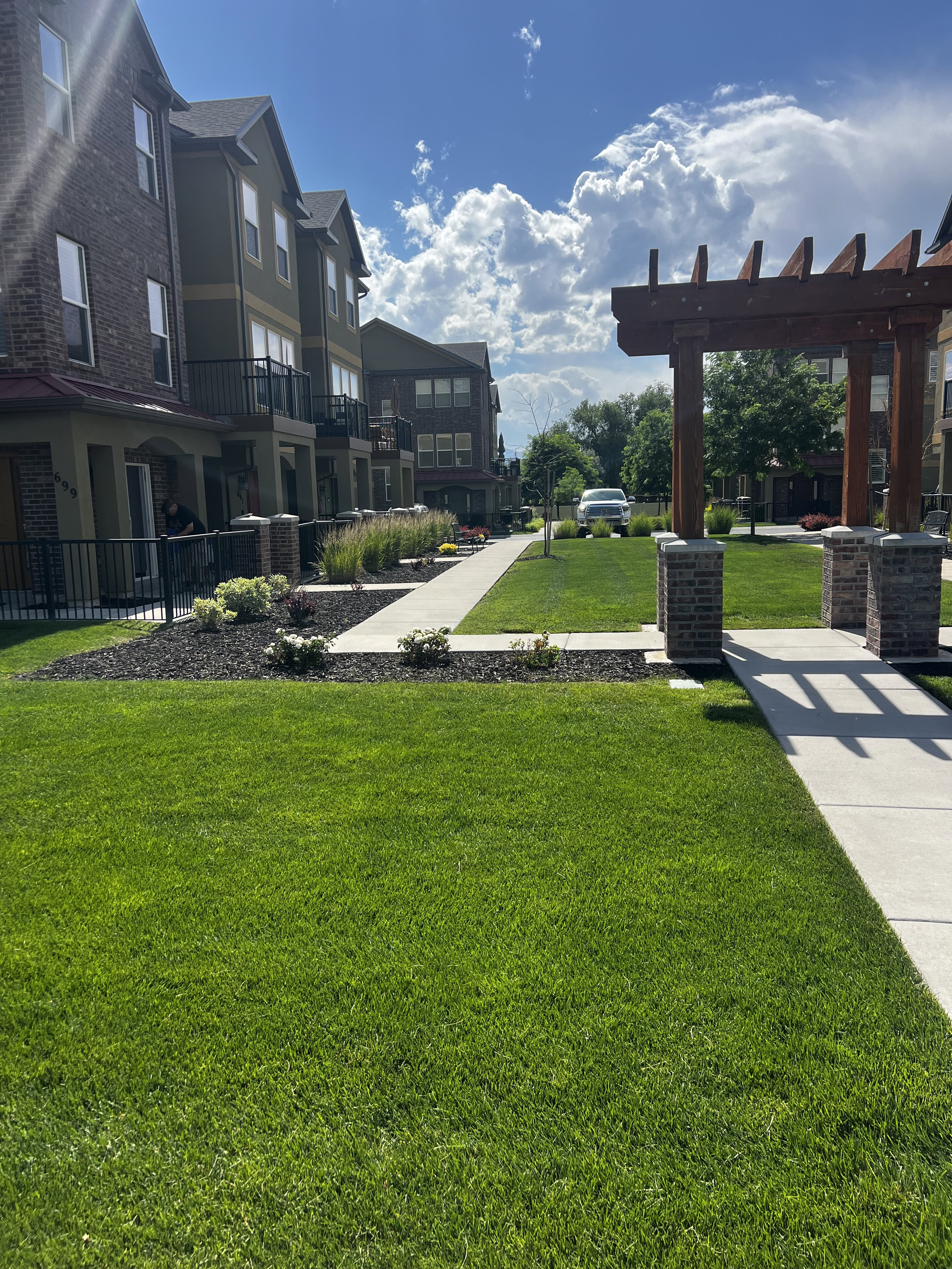 Well-maintained green space with mature landscaping