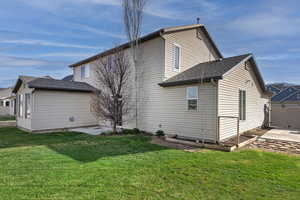 Back of property with a patio