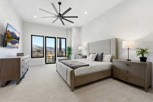 Bedroom with access to outside, light colored carpet, a ceiling fan, a mountain view, and recessed lighting