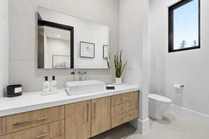 Bathroom with toilet and vanity