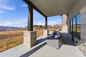View of patio / terrace with a mountain view