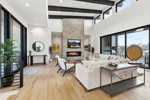 Living area featuring light wood-type flooring and a fireplace