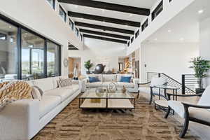 Living room with wood finished floors and recessed lighting