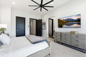 Bedroom with recessed lighting, light carpet, ceiling fan, and ensuite bathroom