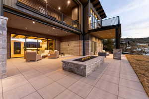 Patio / terrace featuring an outdoor living space with a fire pit and a patio