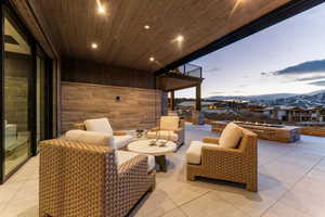 View of patio / terrace with a mountain view and outdoor furniture