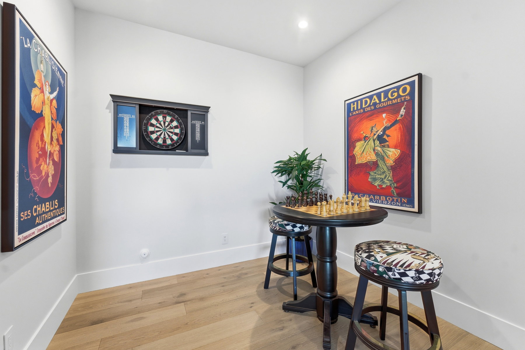 Dining area with light wood finished floors and recessed lighting