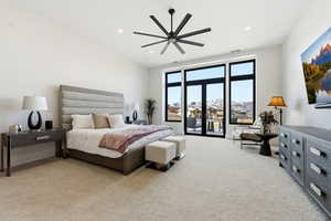 Bedroom featuring access to exterior, light carpet, a ceiling fan, and recessed lighting