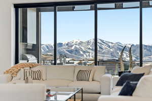 Living room featuring a mountain view and healthy amount of natural light