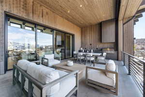 View of patio with exterior kitchen and an outdoor living / dining area