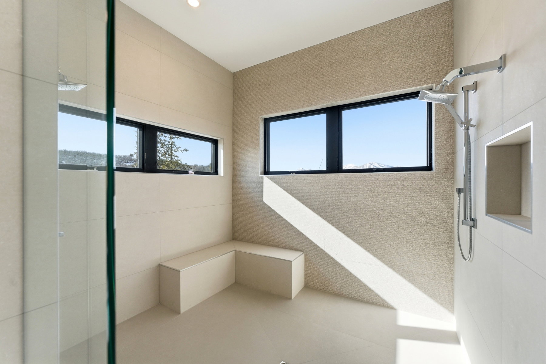 Full bathroom featuring plenty of natural light and a tile shower