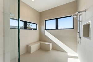 Full bathroom featuring plenty of natural light and a tile shower