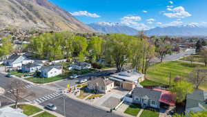 Aerial perspective of suburban area featuring a mountain backdrop