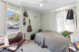 Bedroom with carpet flooring and a ceiling fan